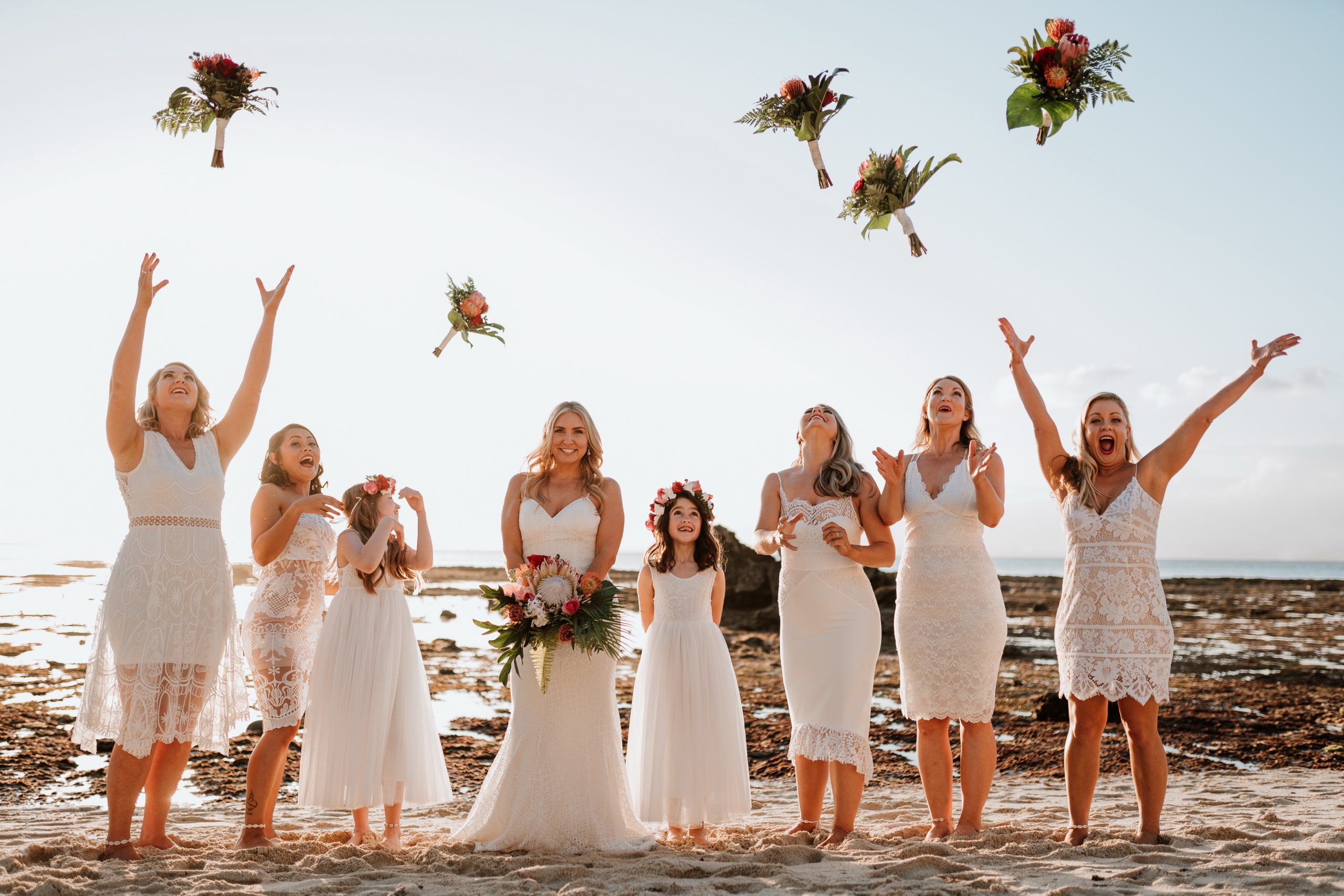 Alexis and Simon threw their wedding bouquets during their Hai Tide Beach Wedding at Hai Tide Beach Resort in Nusa Lembongan, Bali.